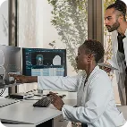 Scientists reviewing cell imaging data